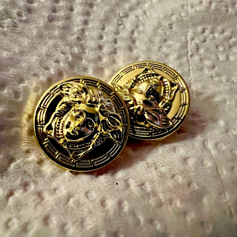 Pair of shiny gold colored Versace buttons!